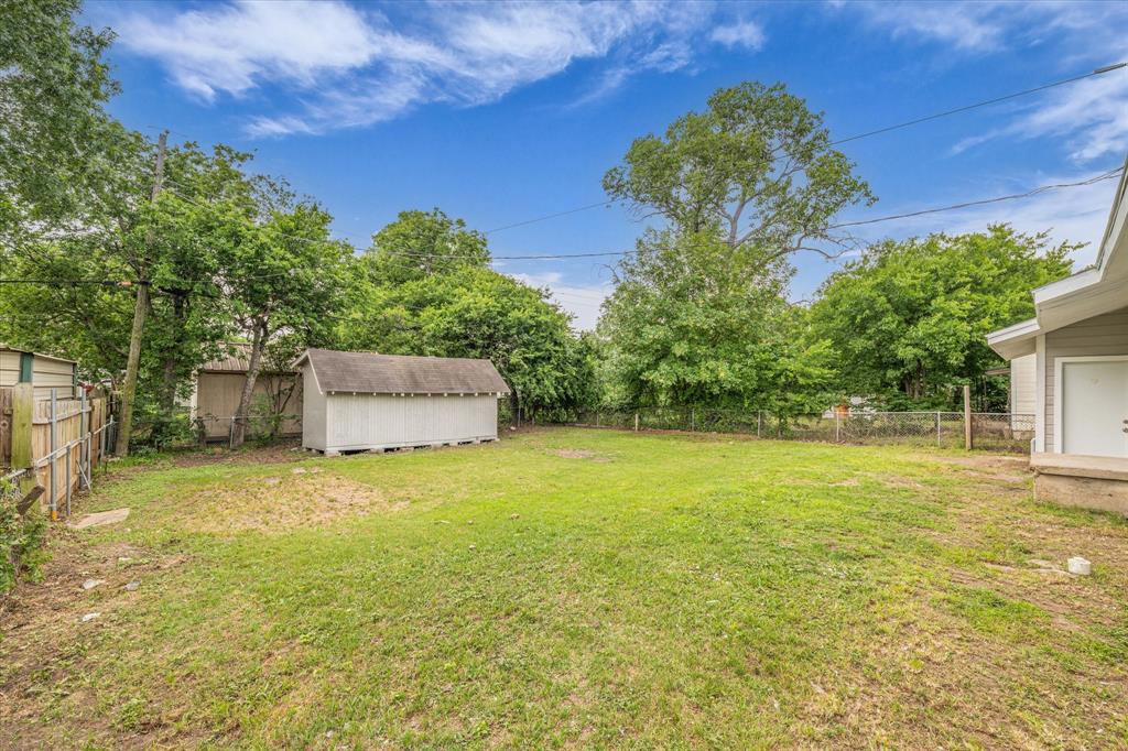 2305 Joey Street Waco, TX 76711 - Photo 21 of 22 a backyard of a house with plants and large trees