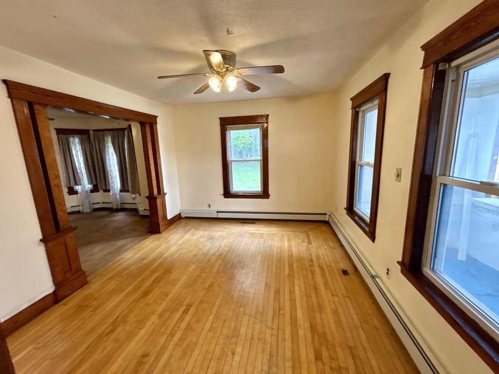 3 Gloucester Road Worcester, MA 01607 - Photo 3 of 12 wooden floor in an empty room with a window