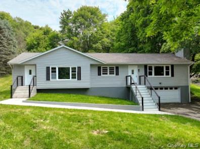 a front view of a house with a yard table and chairs