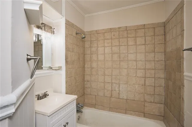 a bathroom with a shower and a sink