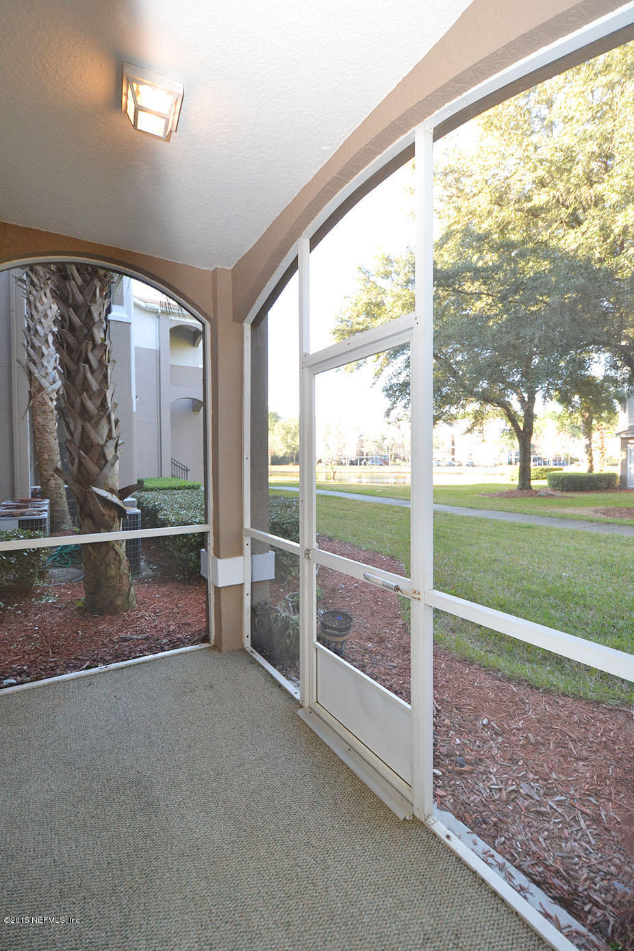 10550 Baymeadows Road, Unit 404 Jacksonville, FL 32256 - Photo 4 of 31 Screened Lanai w/Lake View