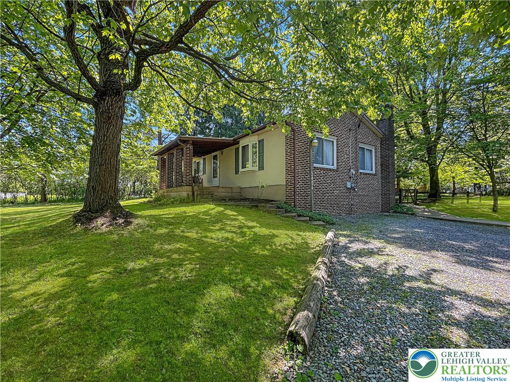 3406 Church Road Easton, PA 18045 - Photo 34 of 39 A classic brick exterior offers charm and enduring appeal, nestled among mature shade trees.