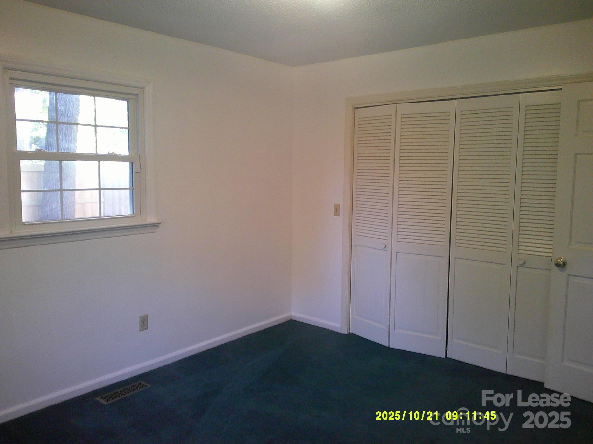 1820 12th Street Northeast Hickory, NC 28601 - Photo 13 of 20 an empty room with a wooden door