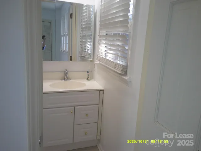 a bathroom with a sink and a vanity
