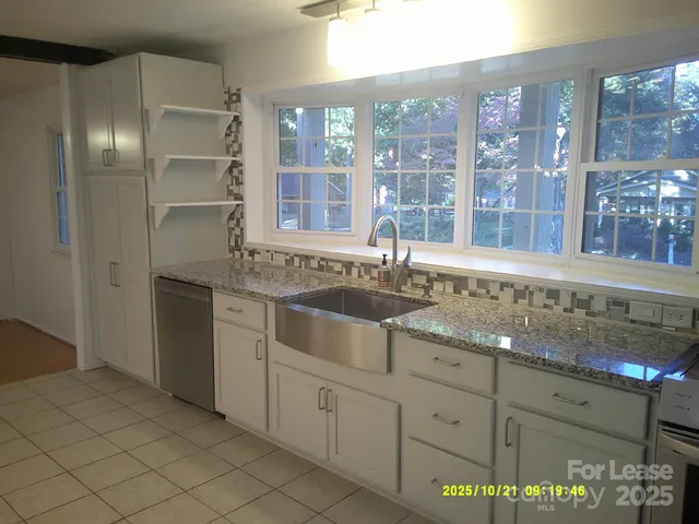 a kitchen with a sink and cabinets