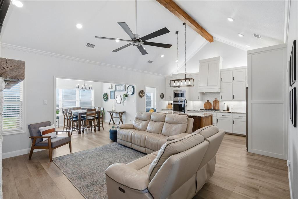 1825 Meadowview Canton, TX 75103 - Photo 11 of 36 a living room with furniture kitchen and a chandelier