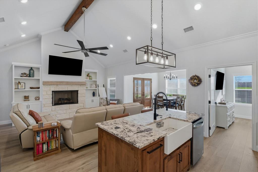 1825 Meadowview Canton, TX 75103 - Photo 20 of 36 a living room with furniture a flat screen tv and a fireplace