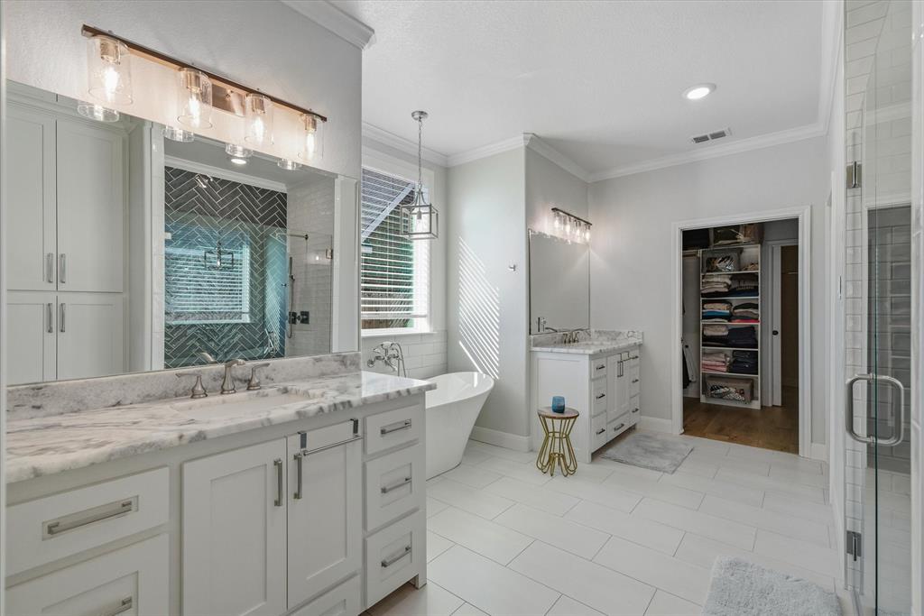 1825 Meadowview Canton, TX 75103 - Photo 24 of 36 a bathroom with a double vanity sink and mirror