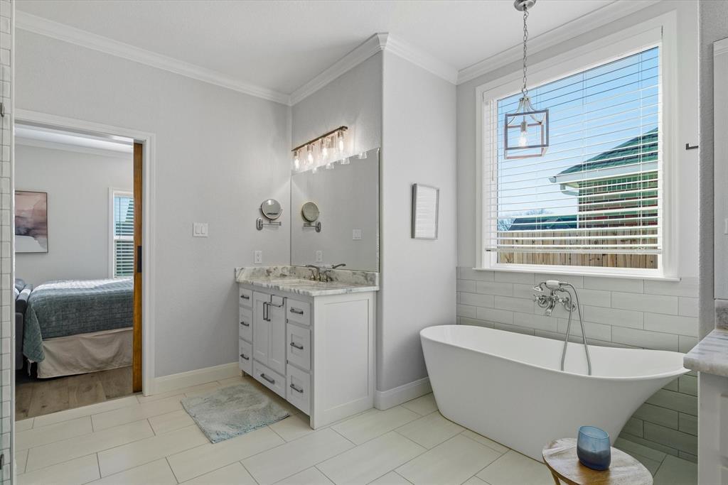 1825 Meadowview Canton, TX 75103 - Photo 25 of 36 a spacious bathroom with a tub sink and mirror