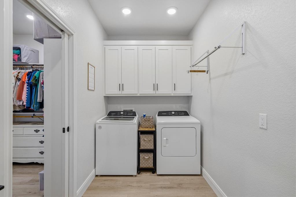 1825 Meadowview Canton, TX 75103 - Photo 28 of 36 a view of a storage and utility room with washer and dryer