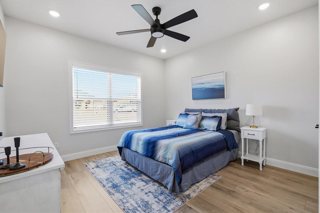 1825 Meadowview Canton, TX 75103 - Photo 6 of 36 a bedroom with a bed and a dresser next to a window