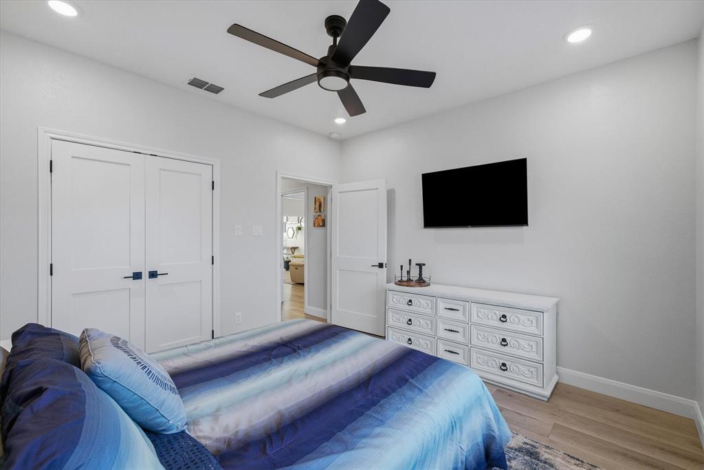 1825 Meadowview Canton, TX 75103 - Photo 7 of 36 a bedroom with a bed and a flat screen tv