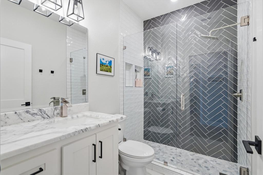 1825 Meadowview Canton, TX 75103 - Photo 8 of 36 a bathroom with a granite countertop sink a toilet and shower curtain
