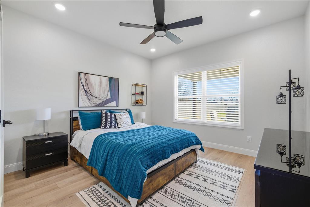 1825 Meadowview Canton, TX 75103 - Photo 9 of 36 a bedroom with a large bed and a window