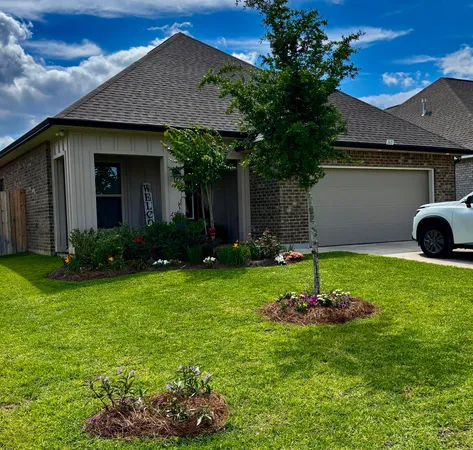 a house with garden in front of it