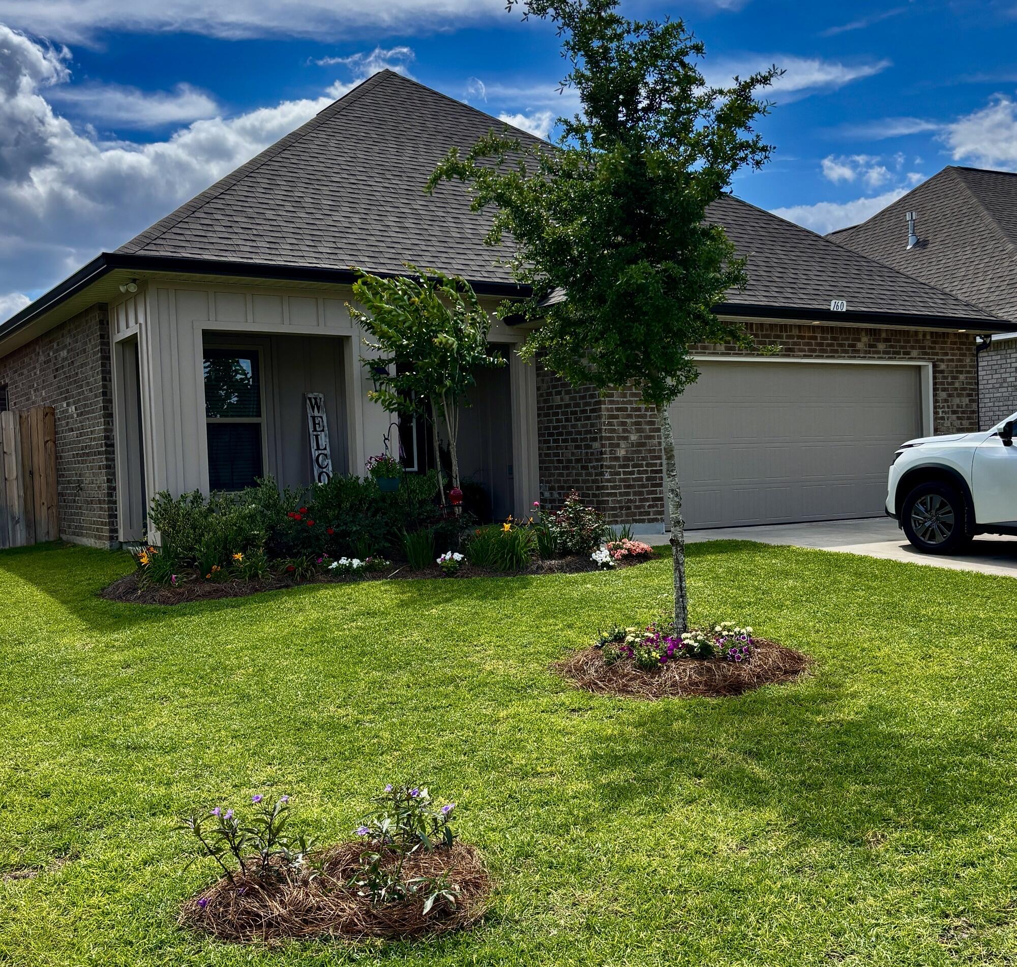 a house with garden in front of it