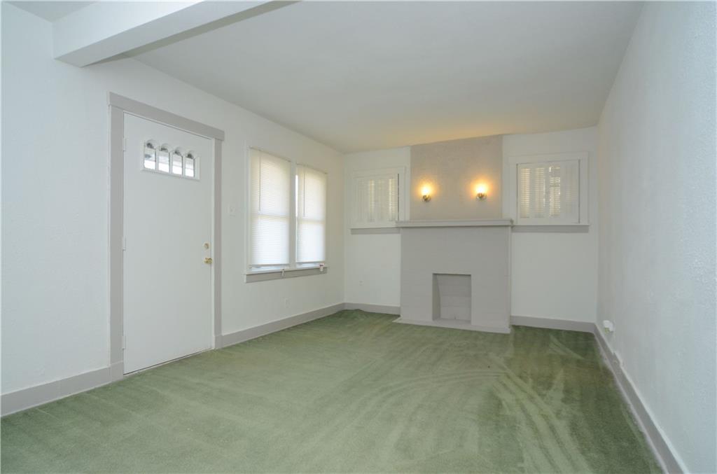 19 Rhodes Avenue Pittsburgh, PA 15220 - Photo 5 of 24 Living room with decorative mantle.