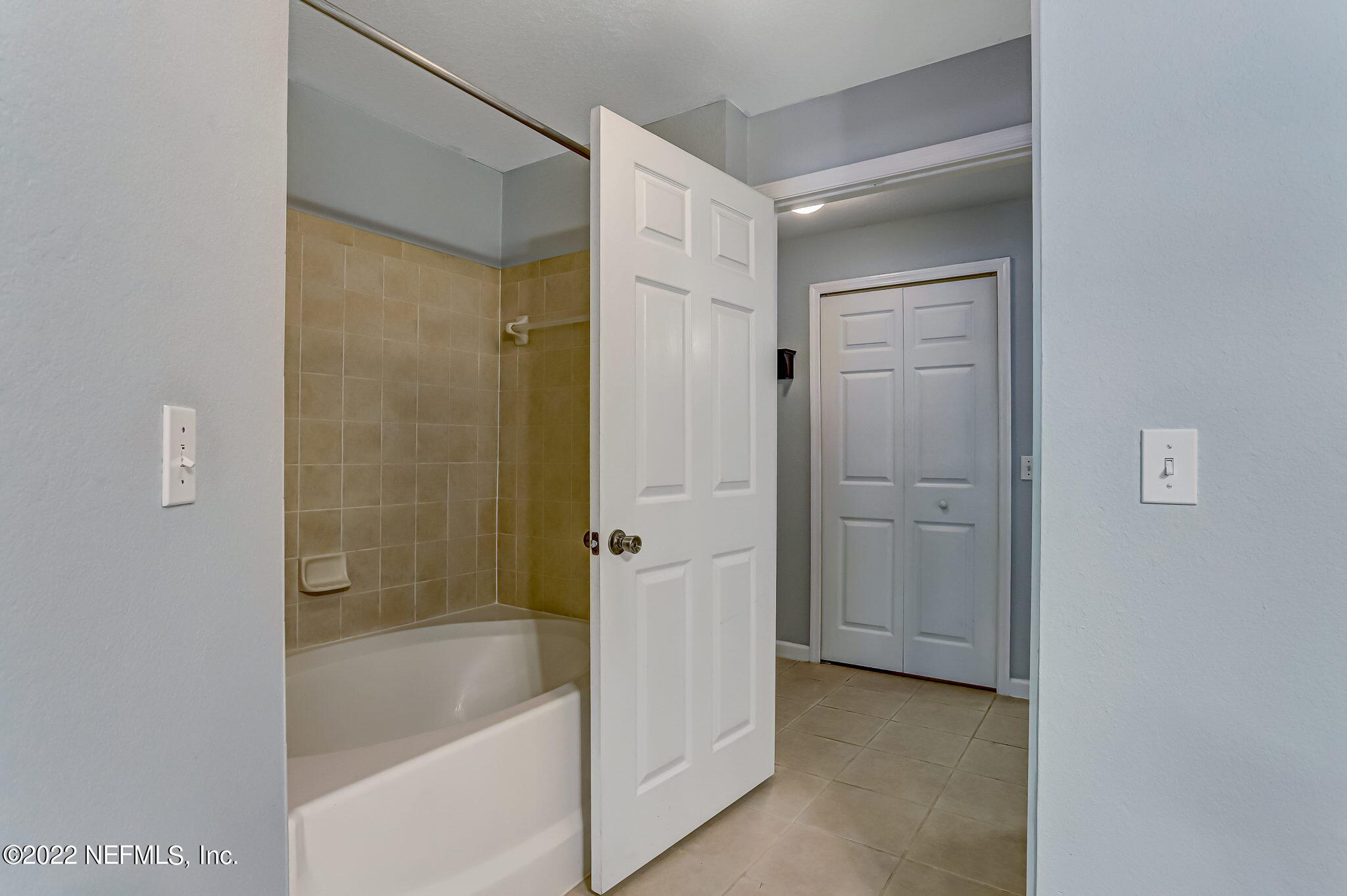 8550 Touchton Road, Unit 1117 Jacksonville, FL 32216 - Photo 34 of 61 a bathroom with a bathtub and a shower