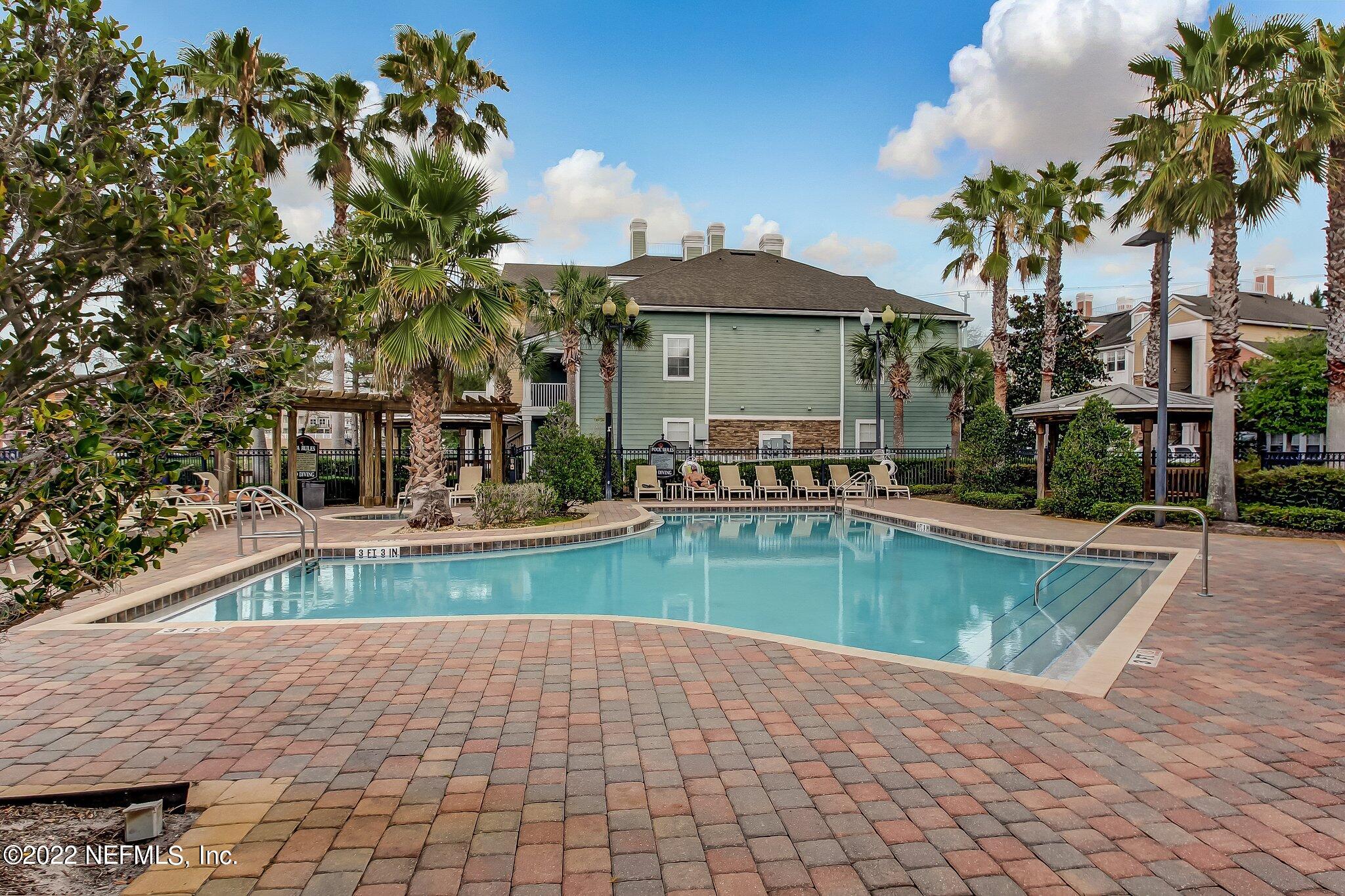 8550 Touchton Road, Unit 1117 Jacksonville, FL 32216 - Photo 43 of 61 a view of a house with swimming pool