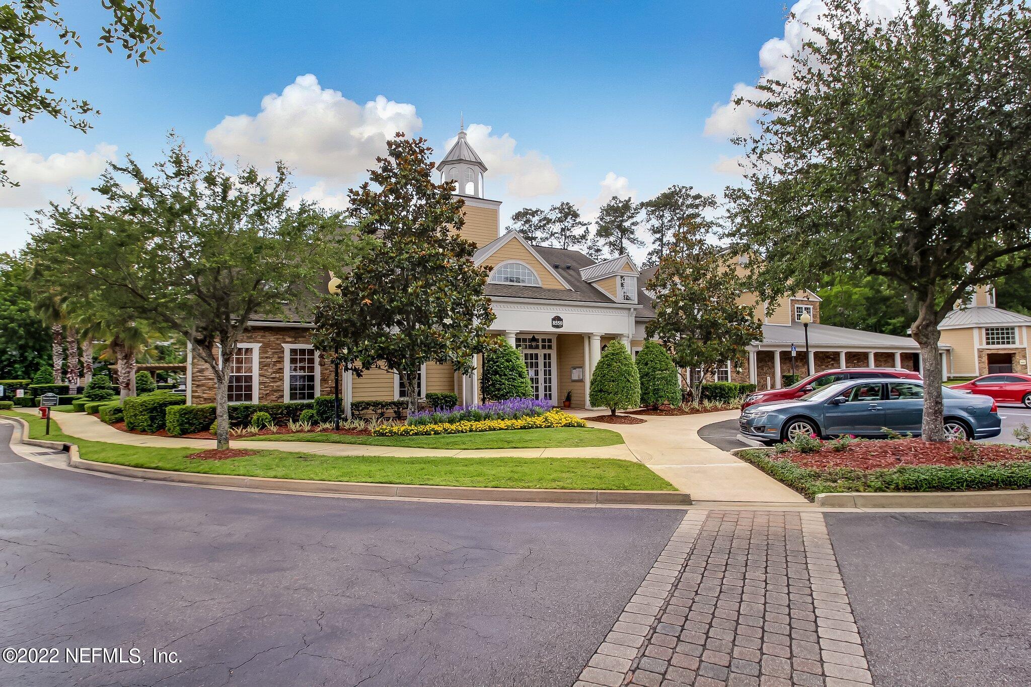 8550 Touchton Road, Unit 1117 Jacksonville, FL 32216 - Photo 45 of 61 a front view of a house with a yard and trees