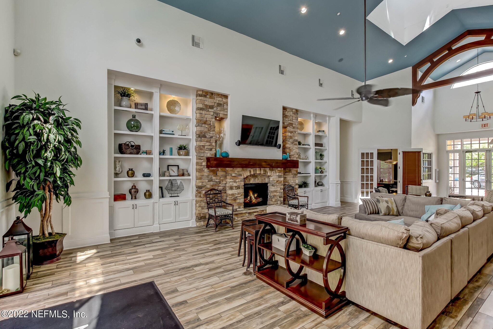 8550 Touchton Road, Unit 1117 Jacksonville, FL 32216 - Photo 46 of 61 a living room with furniture and a fireplace