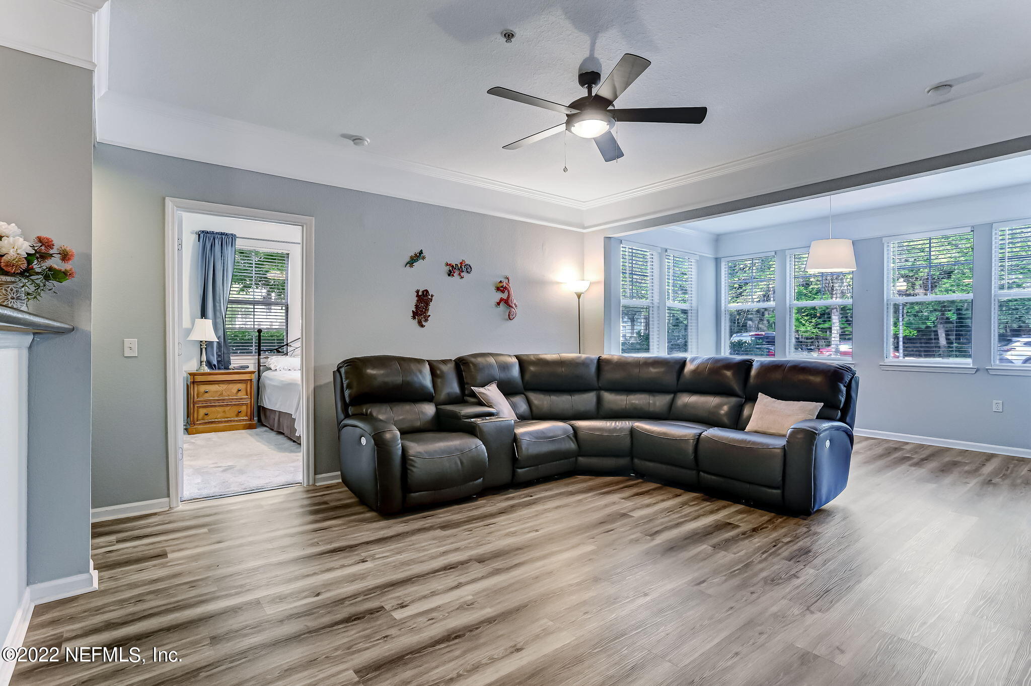 8550 Touchton Road, Unit 1117 Jacksonville, FL 32216 - Photo 5 of 61 a living room with furniture and a large window