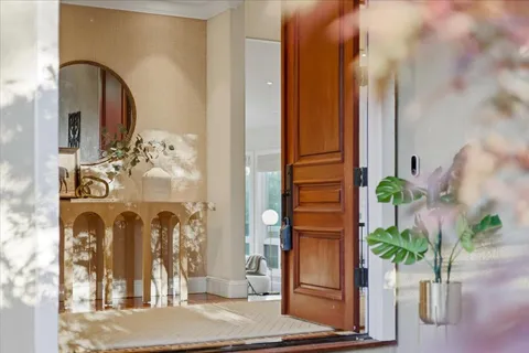 a kitchen with a refrigerator and a sink