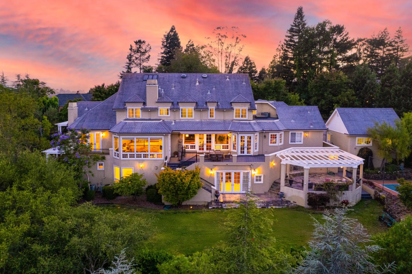 1215 Tournament Drive Hillsborough, CA 94010 - Photo 2 of 16 aerial view of a house with a big yard and large trees