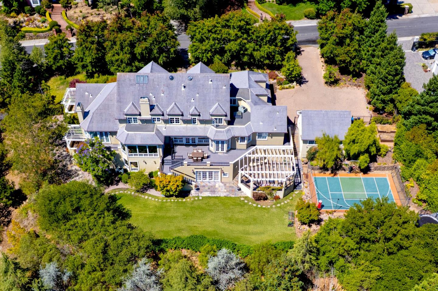 1215 Tournament Drive Hillsborough, CA 94010 - Photo 4 of 16 an aerial view of a house with garden space and street view