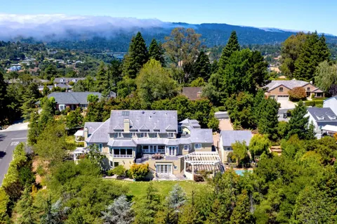 an aerial view of a house with a garden