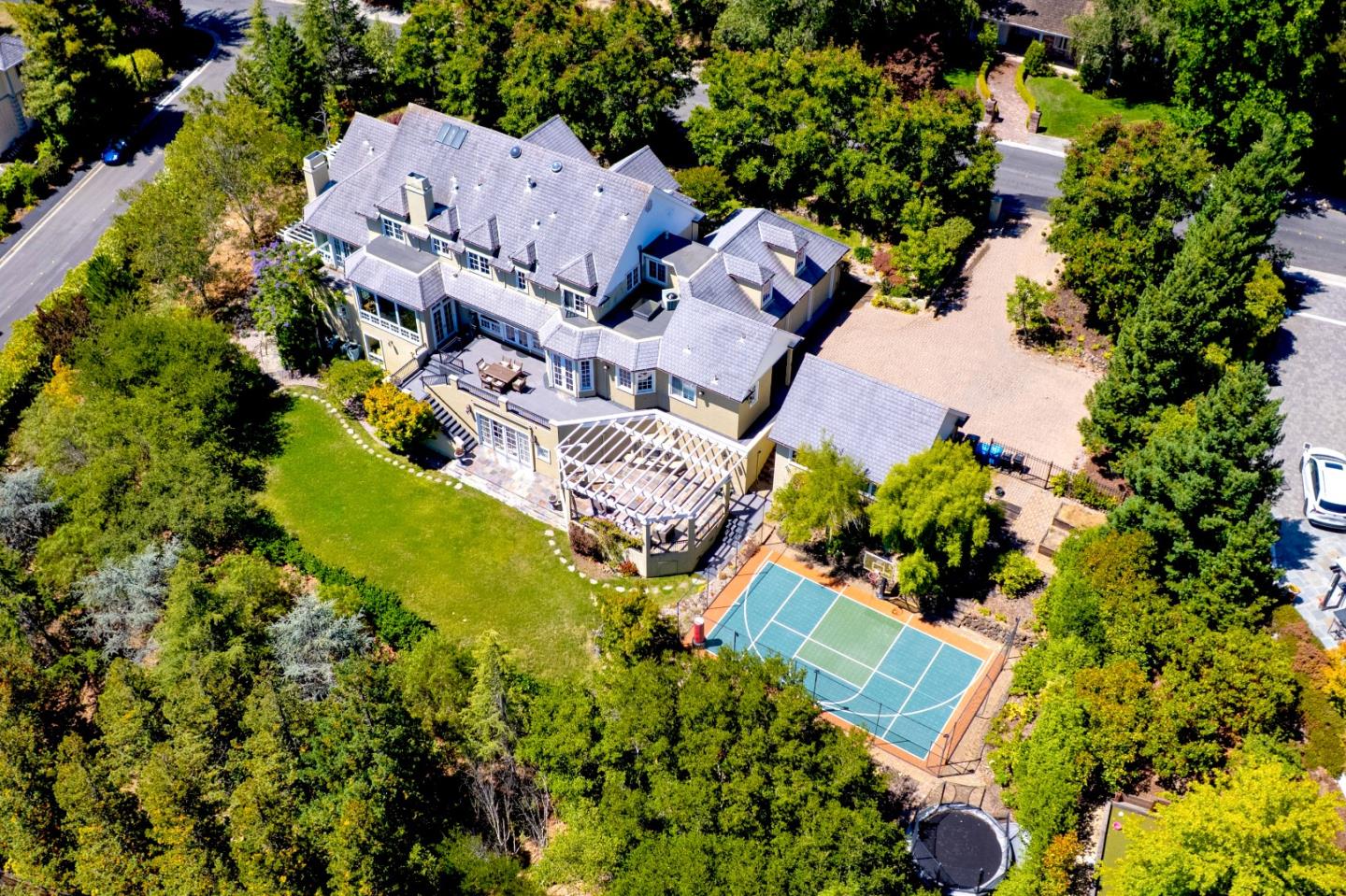 1215 Tournament Drive Hillsborough, CA 94010 - Photo 9 of 16 an aerial view of a house with a yard and garden