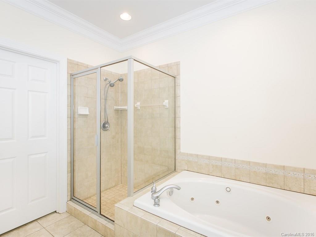 609 Crosswater Lane Fort Mill, SC 29708 - Photo 13 of 24 a bathroom with a bathtub and a shower