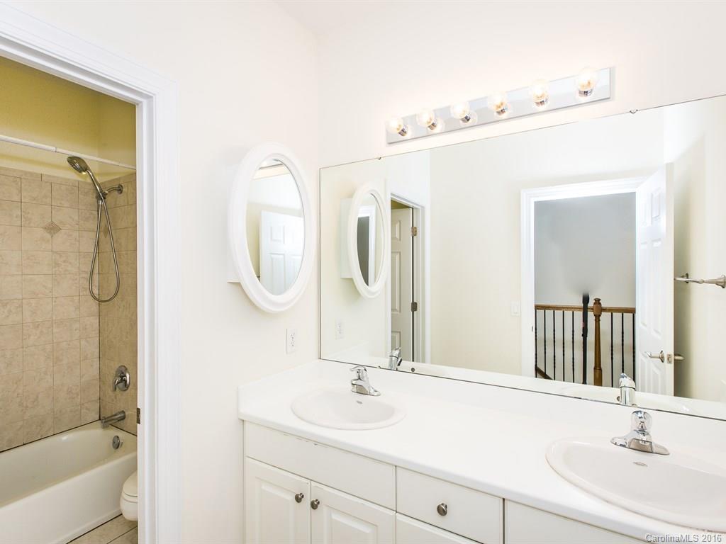 609 Crosswater Lane Fort Mill, SC 29708 - Photo 17 of 24 a bathroom with a sink and a mirror