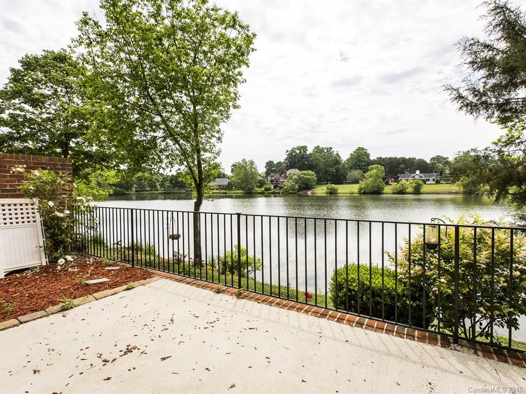 609 Crosswater Lane Fort Mill, SC 29708 - Photo 20 of 24 a view of a street with a lake view