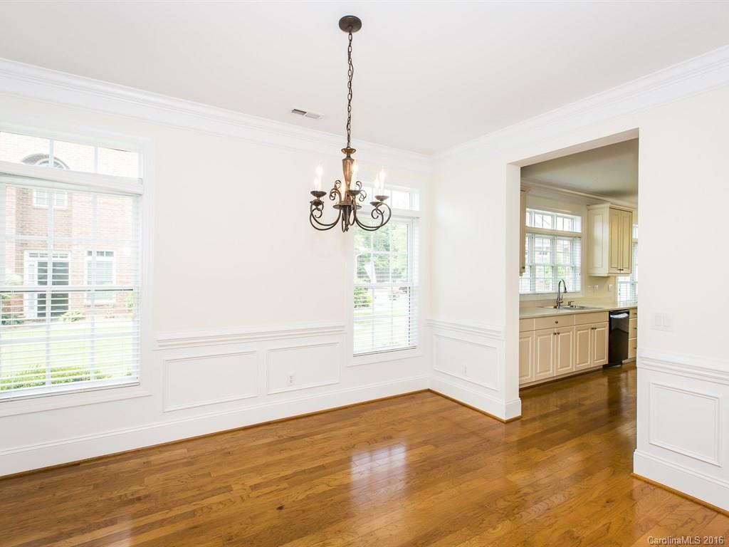 609 Crosswater Lane Fort Mill, SC 29708 - Photo 6 of 24 a view of an empty room with a window and wooden floor