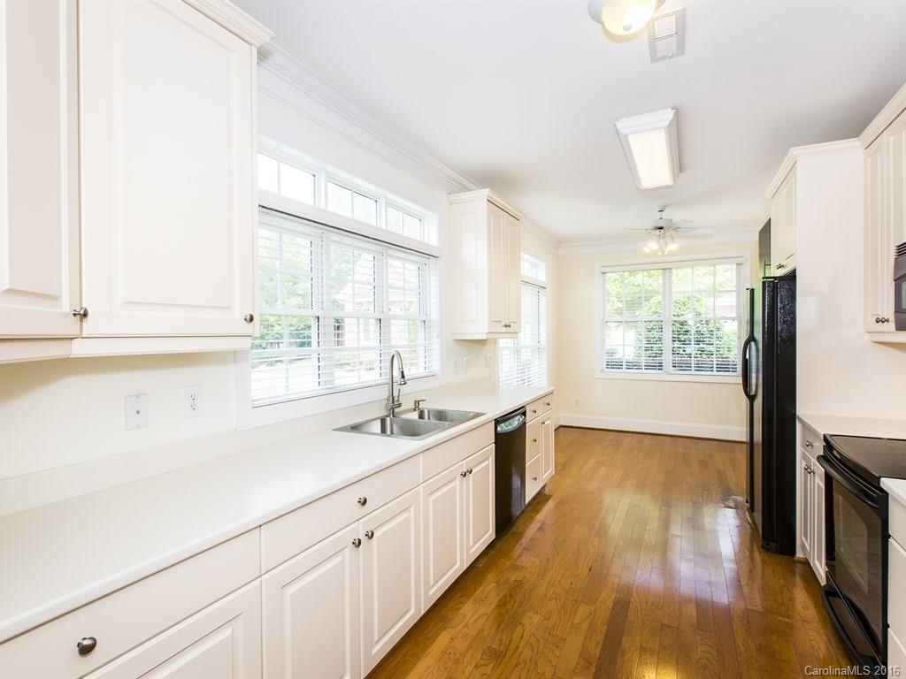 609 Crosswater Lane Fort Mill, SC 29708 - Photo 8 of 24 a kitchen with a sink a window and appliances