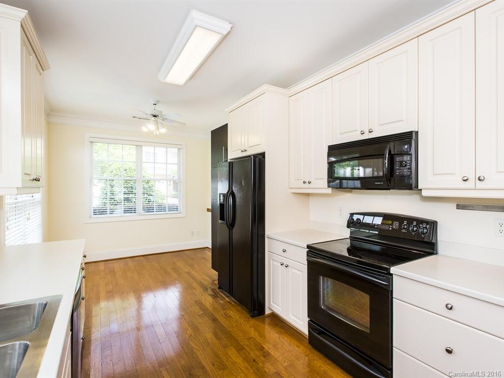 609 Crosswater Lane Fort Mill, SC 29708 - Photo 9 of 24 a kitchen with a stove a microwave and a window