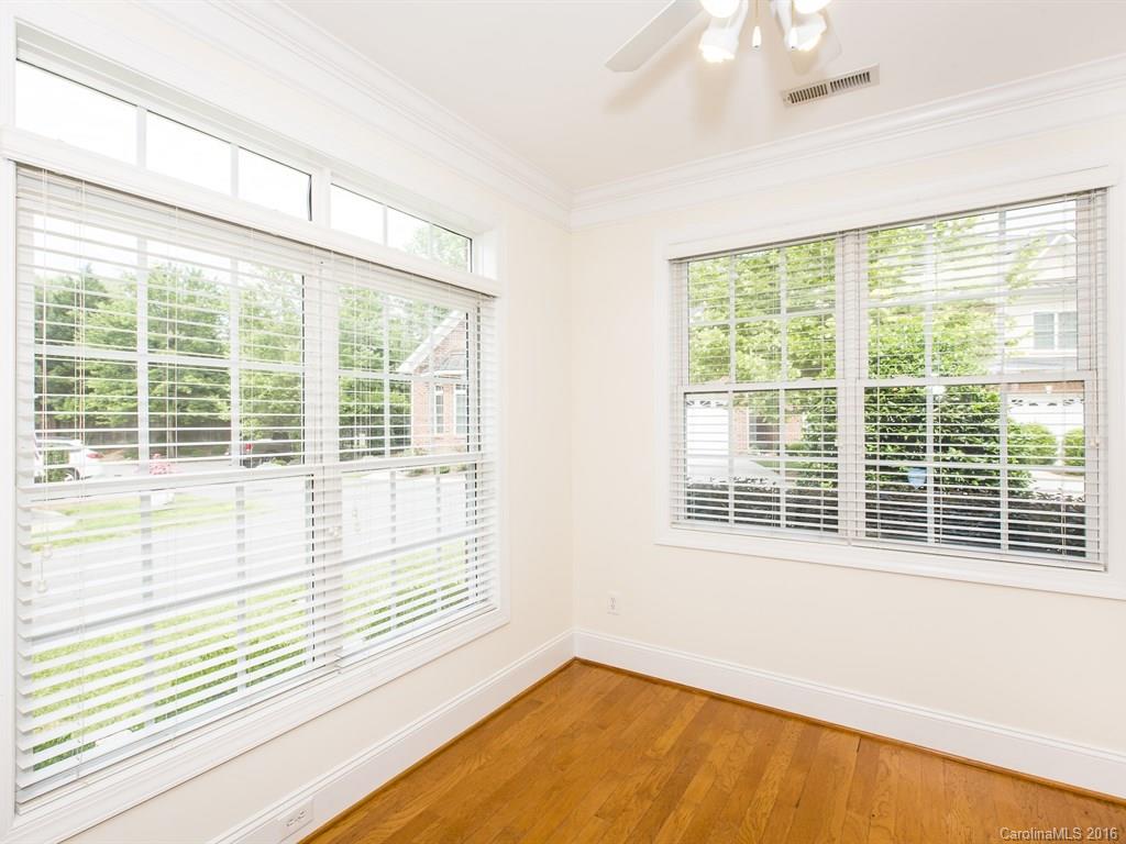 609 Crosswater Lane Fort Mill, SC 29708 - Photo 10 of 24 a view of an empty room with wooden floor and a window