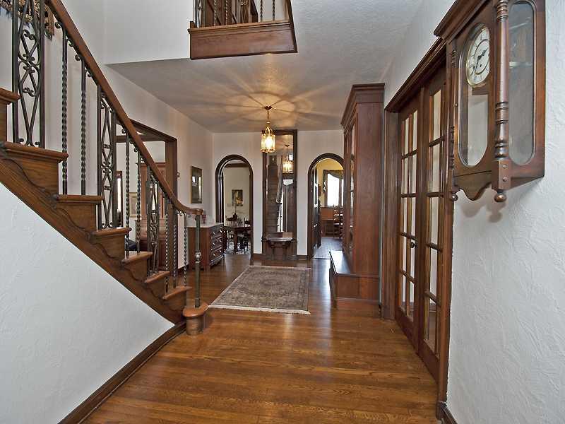 10 Midway Road Mt. Lebanon, PA 15216 - Photo 2 of 16 Entry/Foyer. Dramatic two-story entry and exquisite Old World workmanship. Three-inch wide pegged, carved entry door, soaring ceilings, wrought iron detailing, floor-to-ceiling built-in mirror, original vintage lighting fixture.