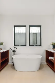 a white bath tub sitting in a bathroom