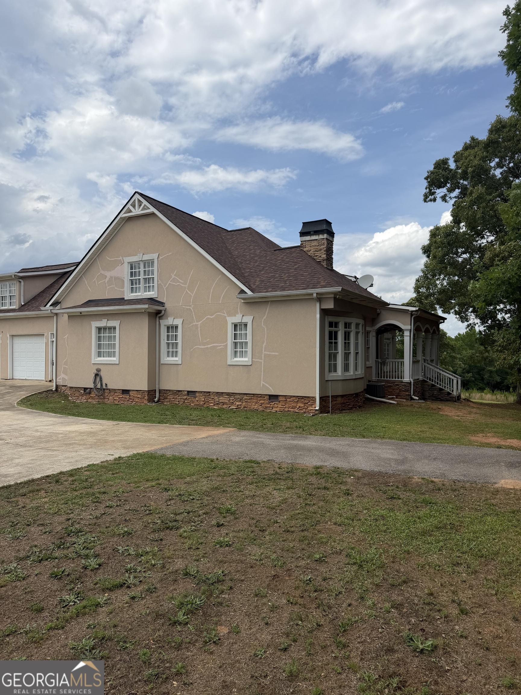 302 Norris Road Barnesville, GA 30204 - Photo 7 of 65 a front view of a house with a garden