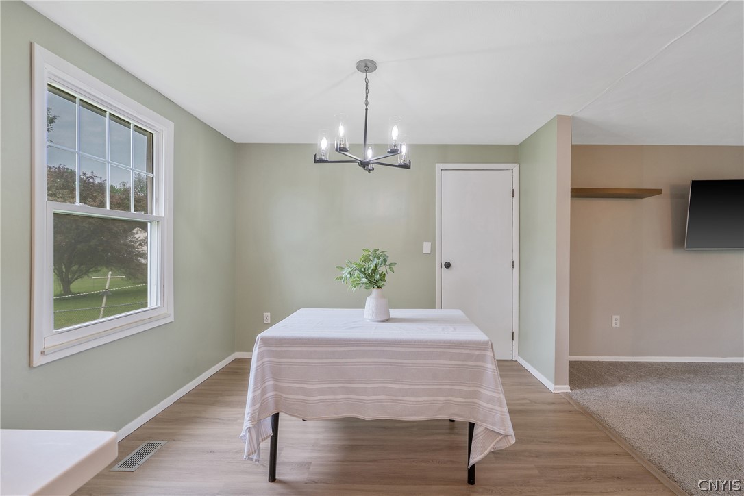 114 Saltwell Road Salina, NY 13090 - Photo 7 of 27 And at this end of the dining area we see the garage door as it steps into the house. What a quick journey your groceries will have into the house from there!