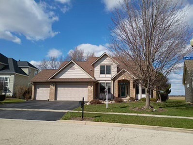 457 Davis Drive Sycamore, IL 60178 - Photo 1 of 32 a front view of a house with a yard
