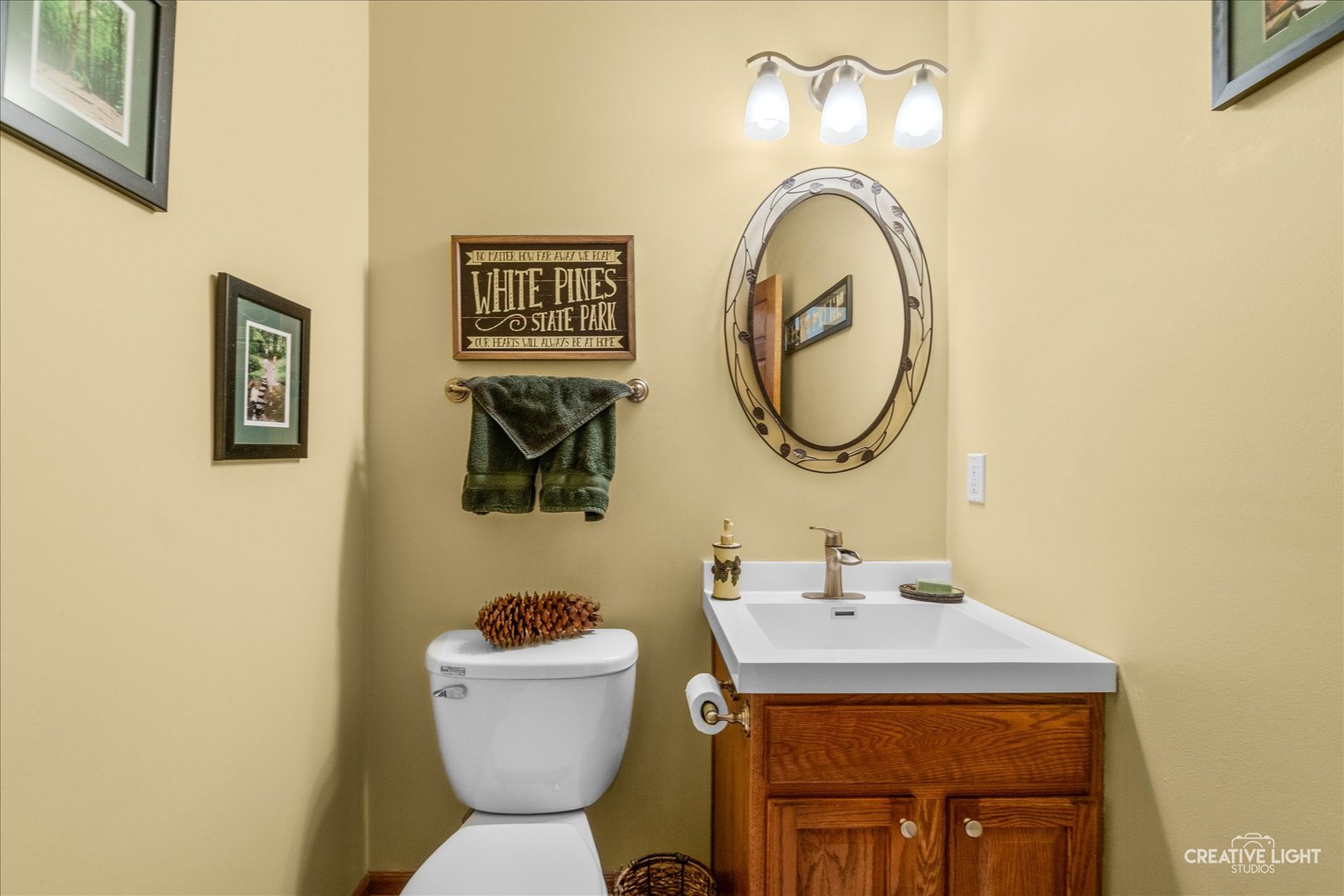 457 Davis Drive Sycamore, IL 60178 - Photo 13 of 32 a bathroom with a sink mirror and toilet