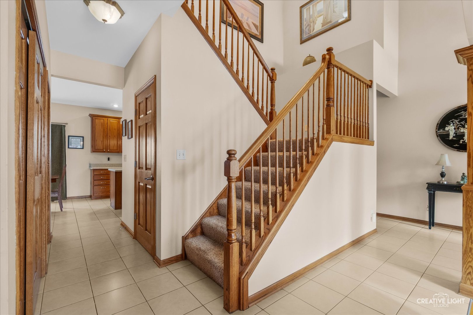 457 Davis Drive Sycamore, IL 60178 - Photo 4 of 32 a view of a hallway with wooden floor and staircase