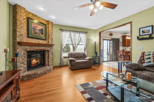 a living room with couches and a flat screen tv