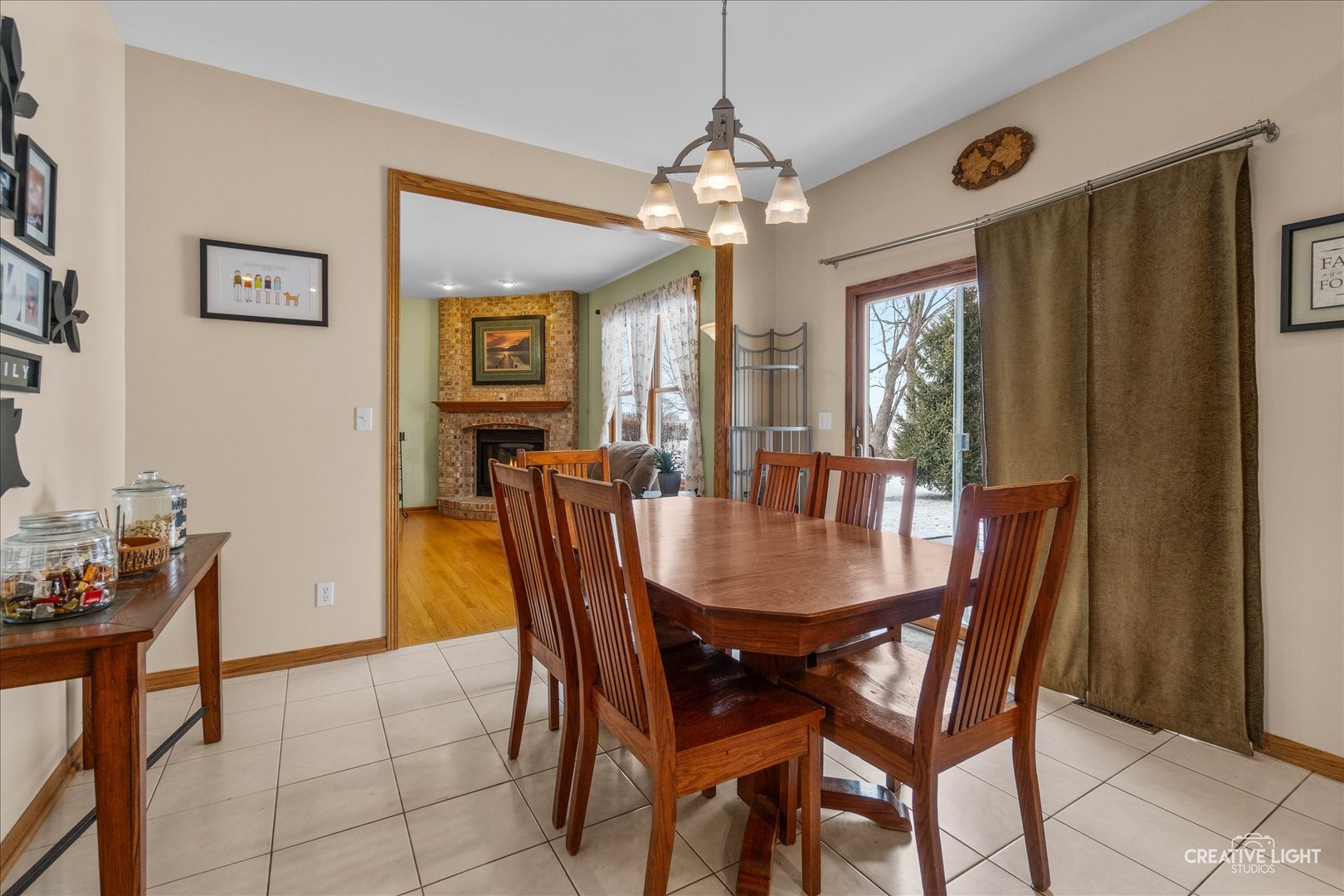 457 Davis Drive Sycamore, IL 60178 - Photo 10 of 32 a view of a dining room with furniture and chandelier