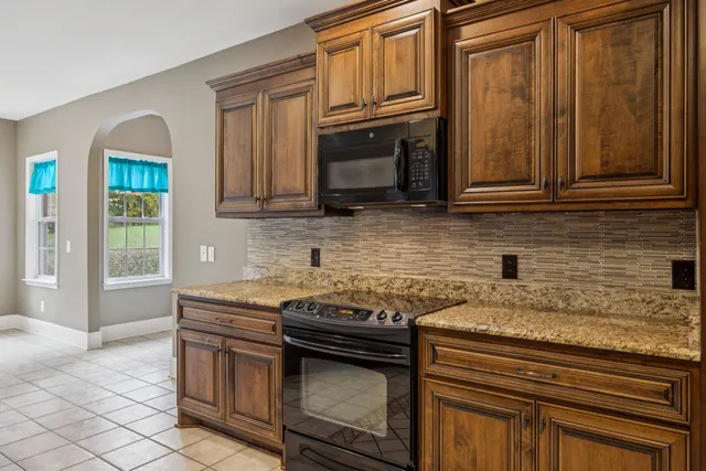 a view of living room filled with furniture and window