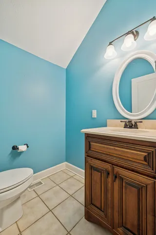 a living room with furniture a flat screen tv and a large window