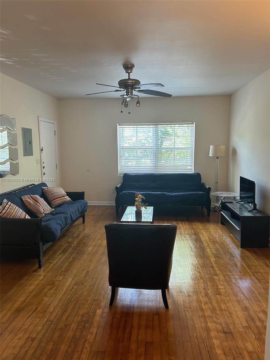1241 13th Street, Unit 4 Miami Beach, FL 33139 - Photo 2 of 13 a living room with furniture fireplace and window